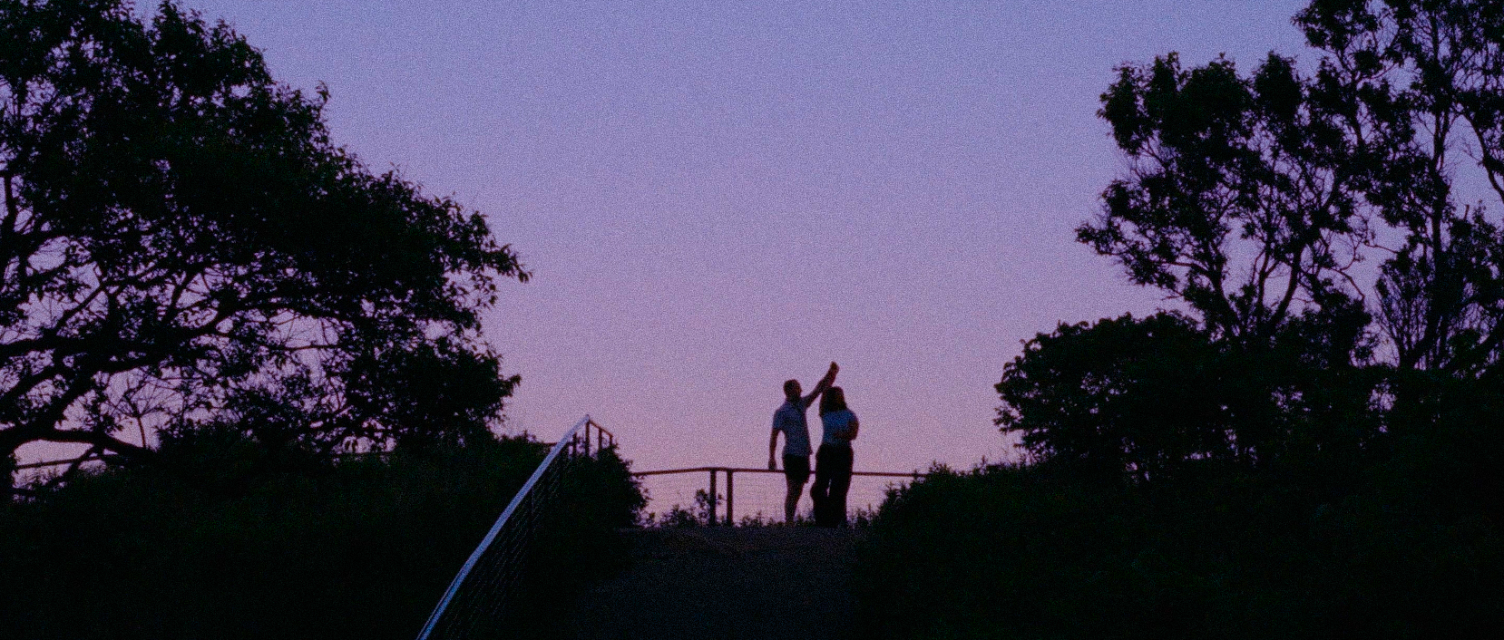 Harman and Patrick silhouetted at dusk